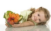 Little girl with a bowl of vegetables